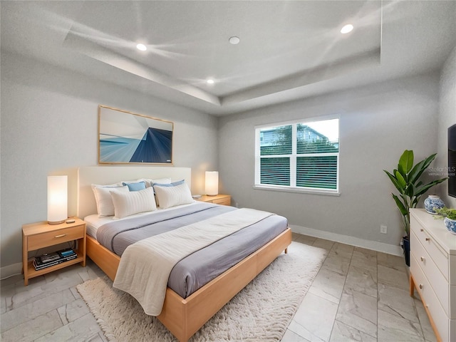 bedroom featuring a tray ceiling