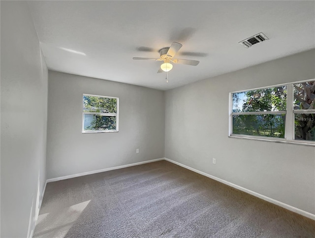 carpeted empty room with ceiling fan