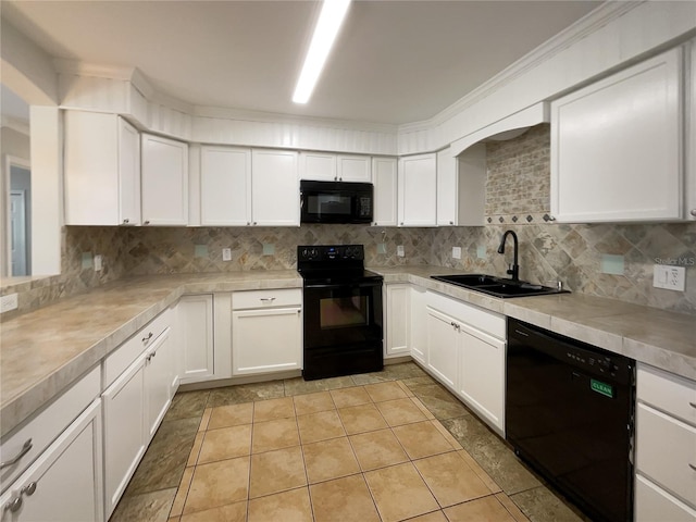 kitchen featuring tasteful backsplash, white cabinets, sink, and black appliances