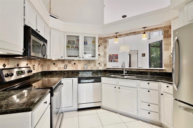 kitchen with appliances with stainless steel finishes, sink, and white cabinets