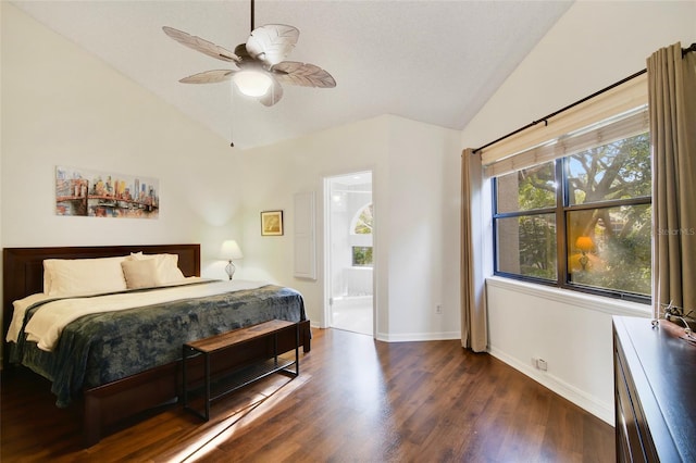 bedroom featuring a textured ceiling, dark wood-type flooring, lofted ceiling, and ensuite bathroom