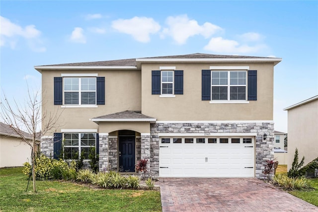 view of front of house featuring a garage and a front yard