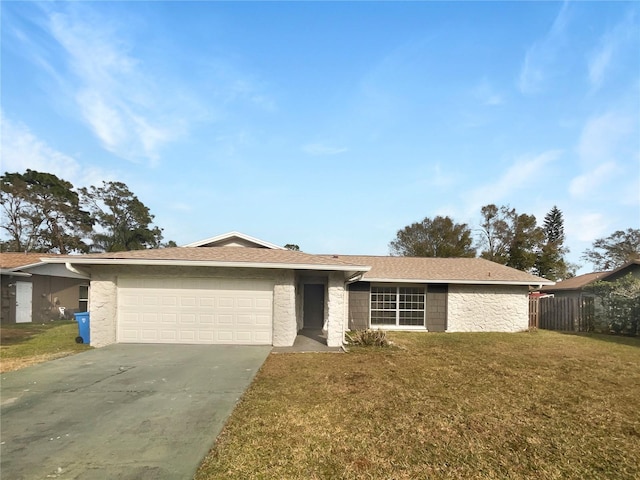 single story home featuring a garage and a front lawn