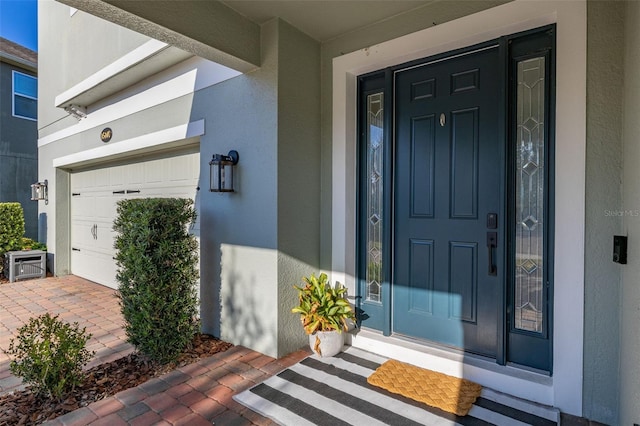 doorway to property featuring a garage