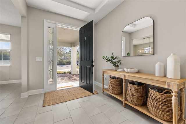 tiled entryway featuring a wealth of natural light