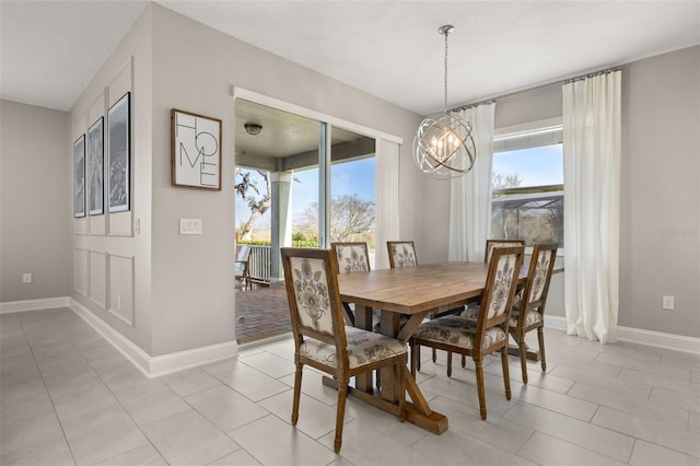 tiled dining space with a notable chandelier