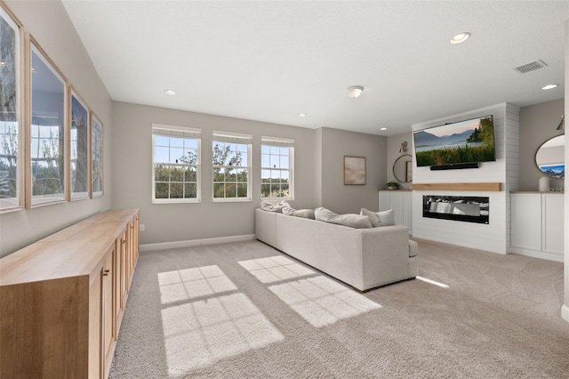 unfurnished living room with light colored carpet