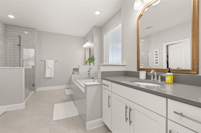 bathroom with vanity, tile patterned floors, and separate shower and tub