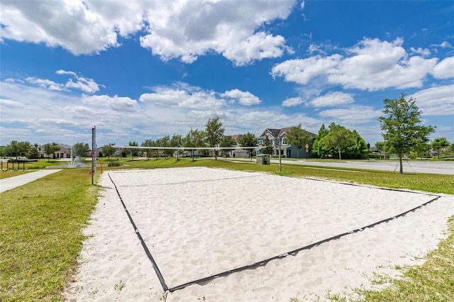 view of community featuring a lawn and volleyball court