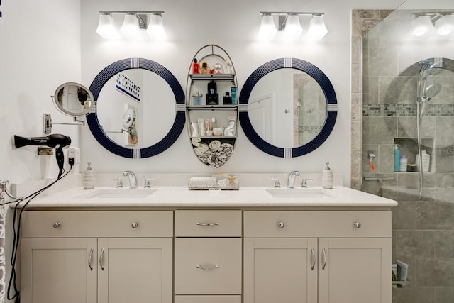 bathroom with vanity and a shower with door