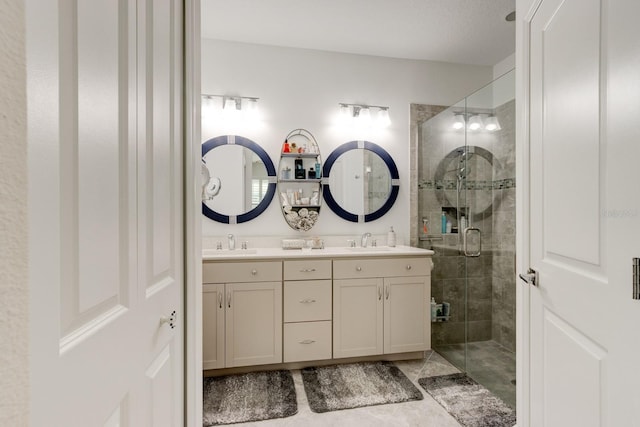 bathroom with vanity and a shower with door