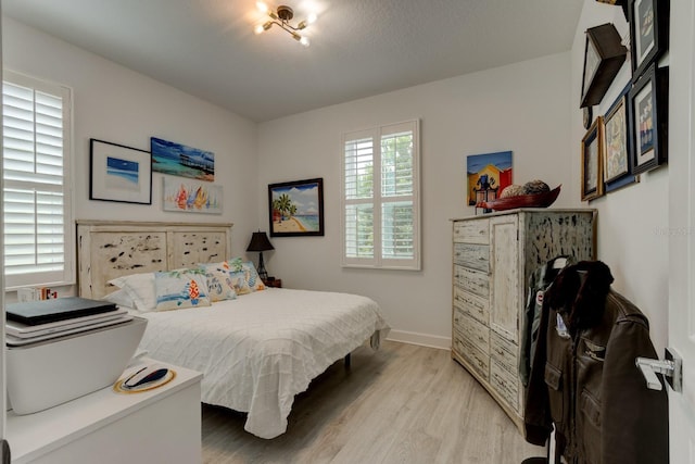 bedroom with light hardwood / wood-style floors