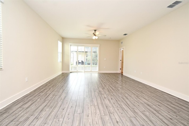 unfurnished living room with ceiling fan and light hardwood / wood-style flooring