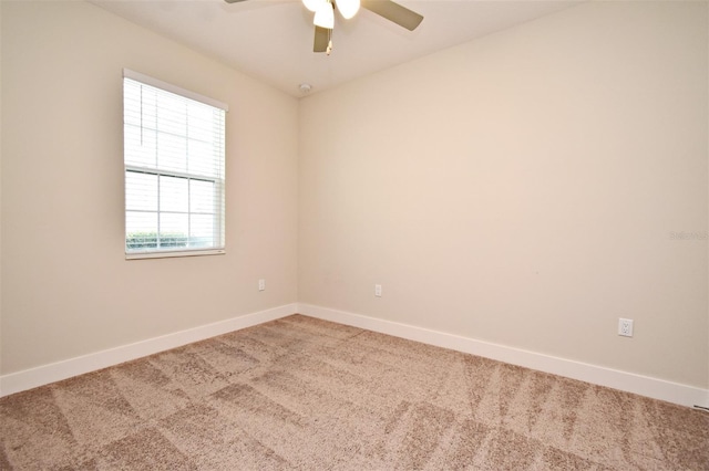 unfurnished room with carpet and ceiling fan