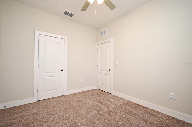 carpeted empty room with ceiling fan