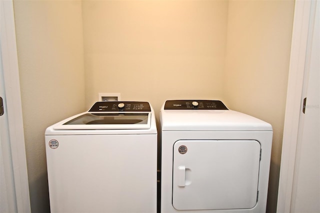 washroom featuring washing machine and dryer