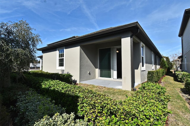 rear view of house featuring a patio