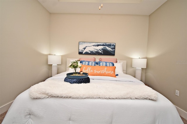 bedroom with baseboards