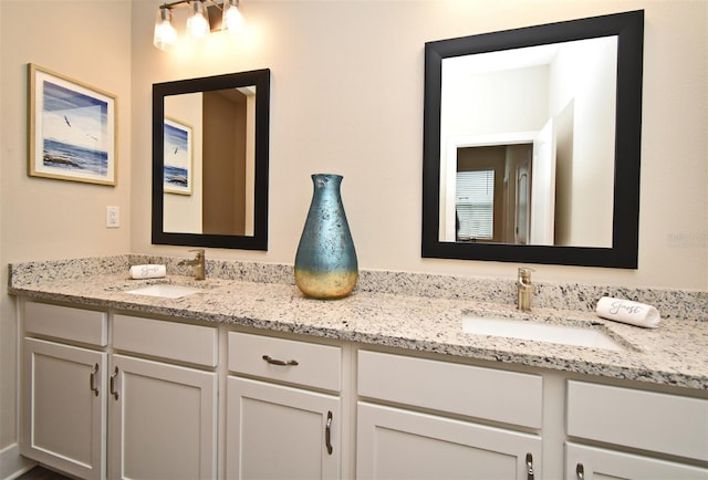 bathroom featuring double vanity and a sink