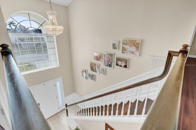 entryway featuring an inviting chandelier and light hardwood / wood-style floors