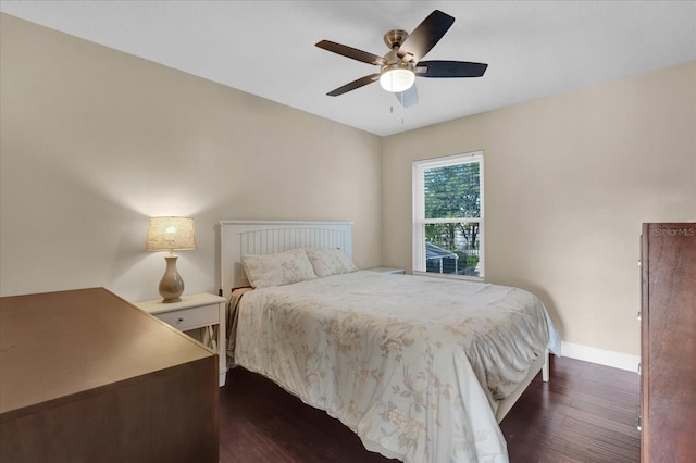 bedroom featuring ceiling fan and dark hardwood / wood-style floors