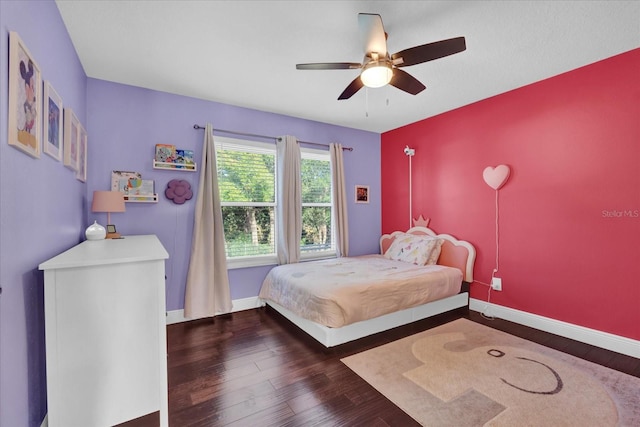 bedroom with dark wood-type flooring and ceiling fan