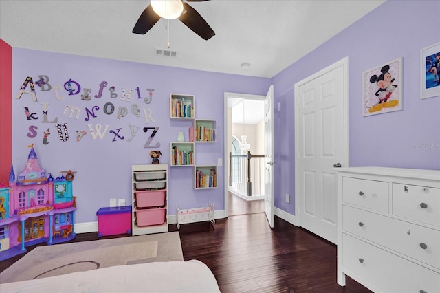 playroom featuring dark hardwood / wood-style floors and ceiling fan