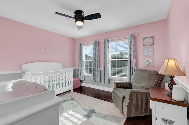 bedroom featuring dark wood-type flooring and ceiling fan