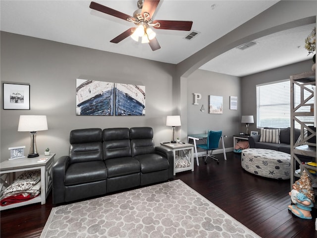 living room featuring hardwood / wood-style floors and ceiling fan