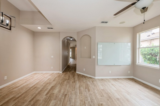 empty room with light hardwood / wood-style flooring and ceiling fan