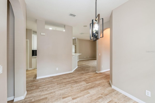 unfurnished dining area featuring light hardwood / wood-style flooring