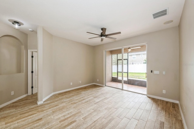 spare room with ceiling fan and light hardwood / wood-style flooring