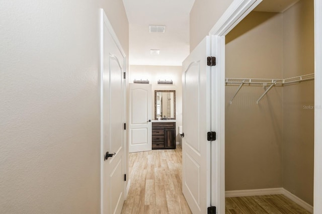 hallway featuring light wood-type flooring