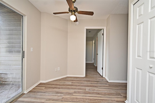 spare room with ceiling fan and light hardwood / wood-style floors