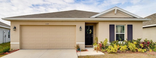 ranch-style home with a garage