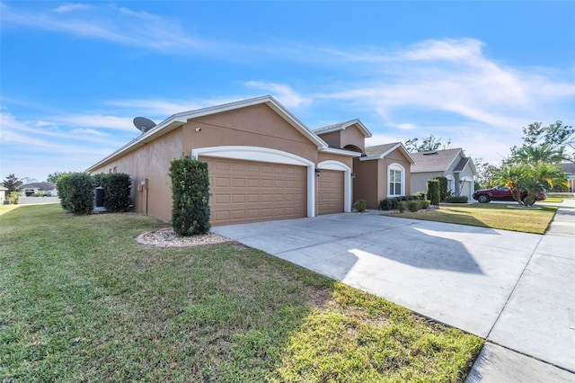 ranch-style house with a garage and a front lawn