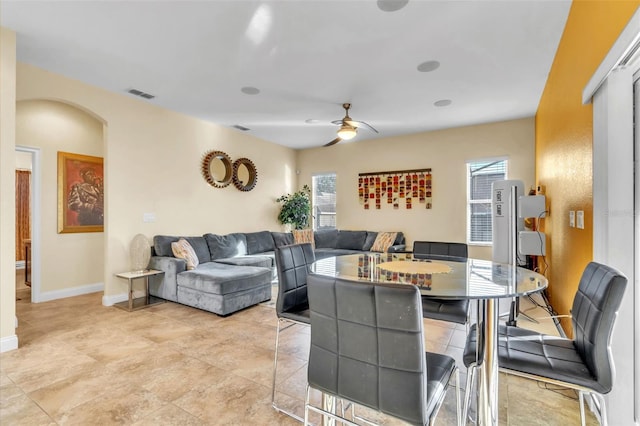 dining space featuring ceiling fan and a healthy amount of sunlight