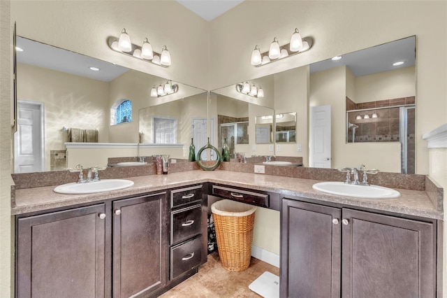 bathroom with vanity and a shower with shower door