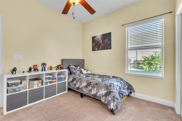 bedroom with ceiling fan and carpet