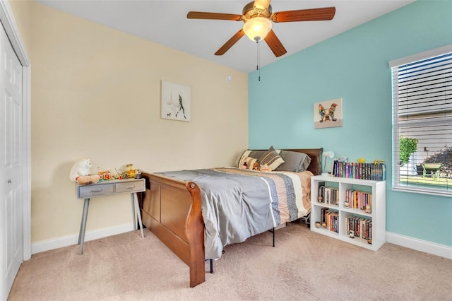 carpeted bedroom with a closet and ceiling fan