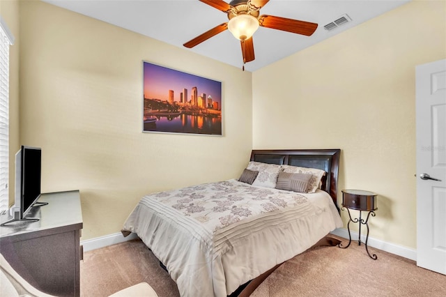 bedroom with ceiling fan and light colored carpet