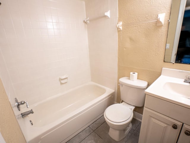 full bathroom with tile patterned flooring, vanity, shower / washtub combination, and toilet