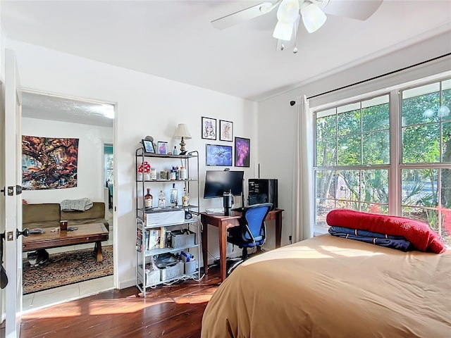 bedroom featuring a ceiling fan and wood finished floors