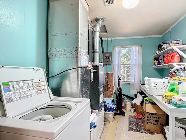 laundry area featuring ornamental molding, laundry area, visible vents, and washer / clothes dryer