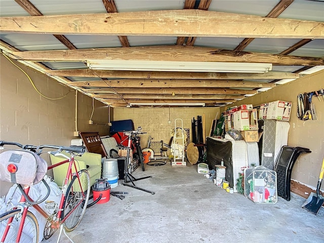 interior space with concrete block wall