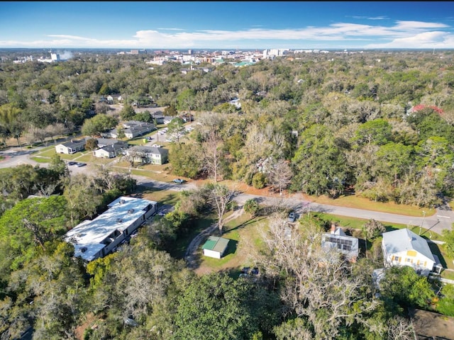 drone / aerial view featuring a forest view