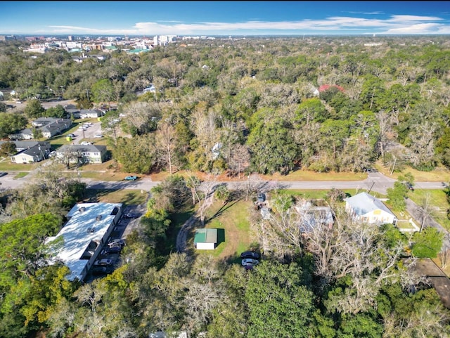 birds eye view of property featuring a wooded view