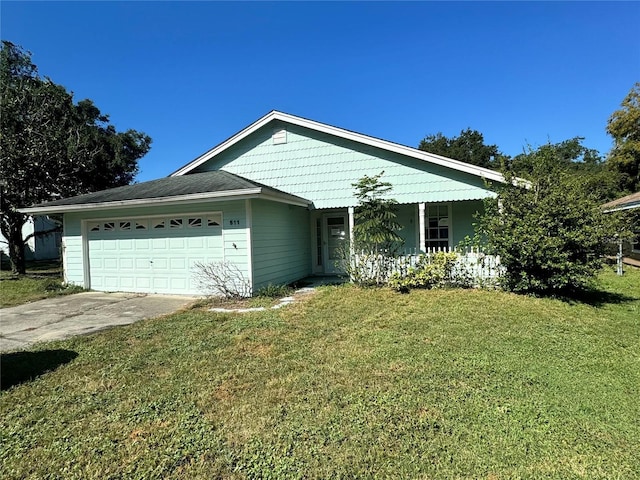 view of front facade with a garage and a front lawn