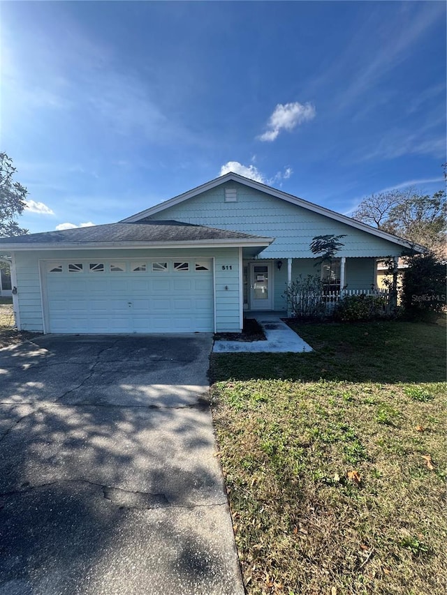 view of front facade with a garage and a front yard