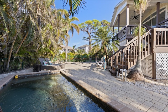 exterior space featuring a patio and ceiling fan